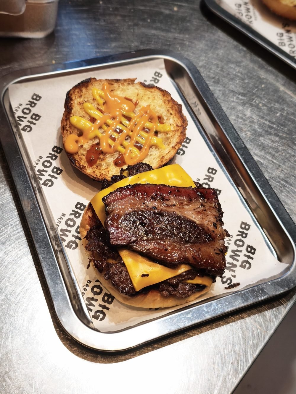 Smash Bacon Burger with smoked beef bacon, melted cheese and sauces